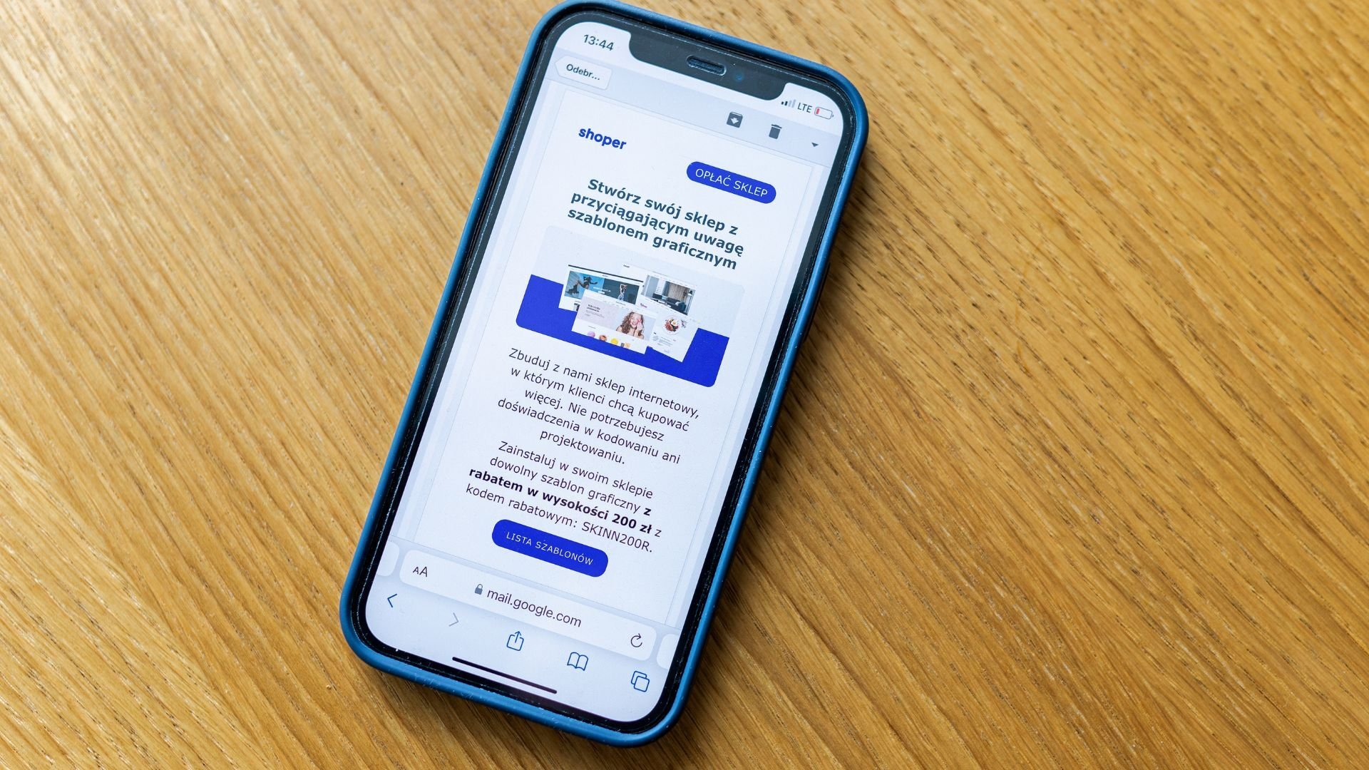 a phone sitting on the table showing an email marketing campaign on the screen