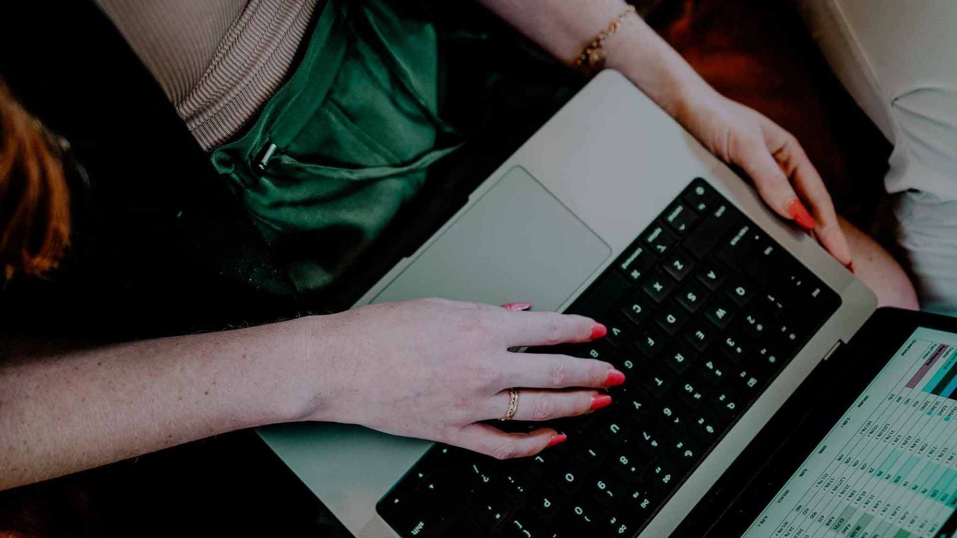 birds-eye view of an xagency employee on their laptop