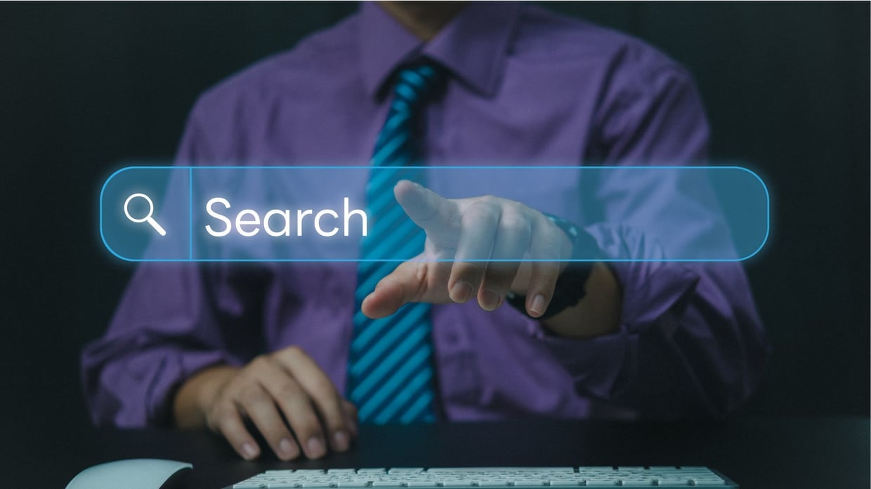 Person in business attire touching virtual search bar