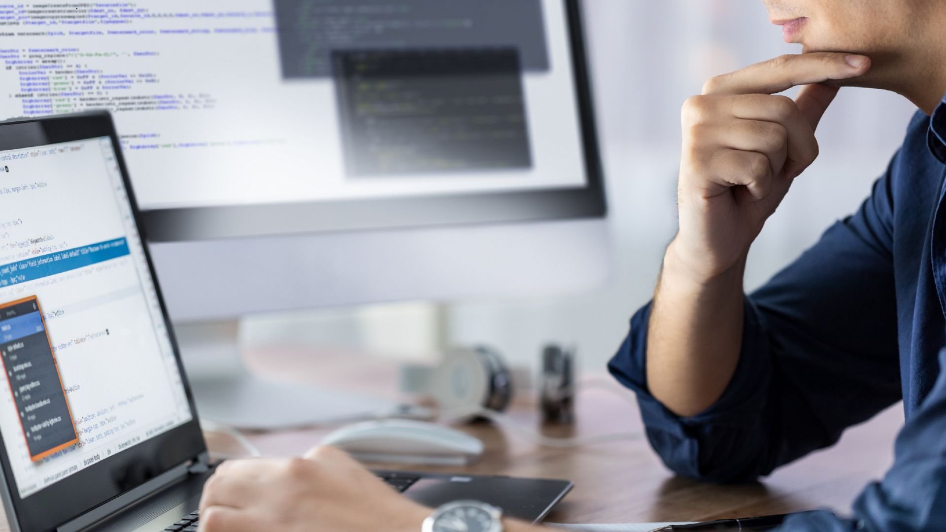 a person sitting working at a computer working on seo for a client